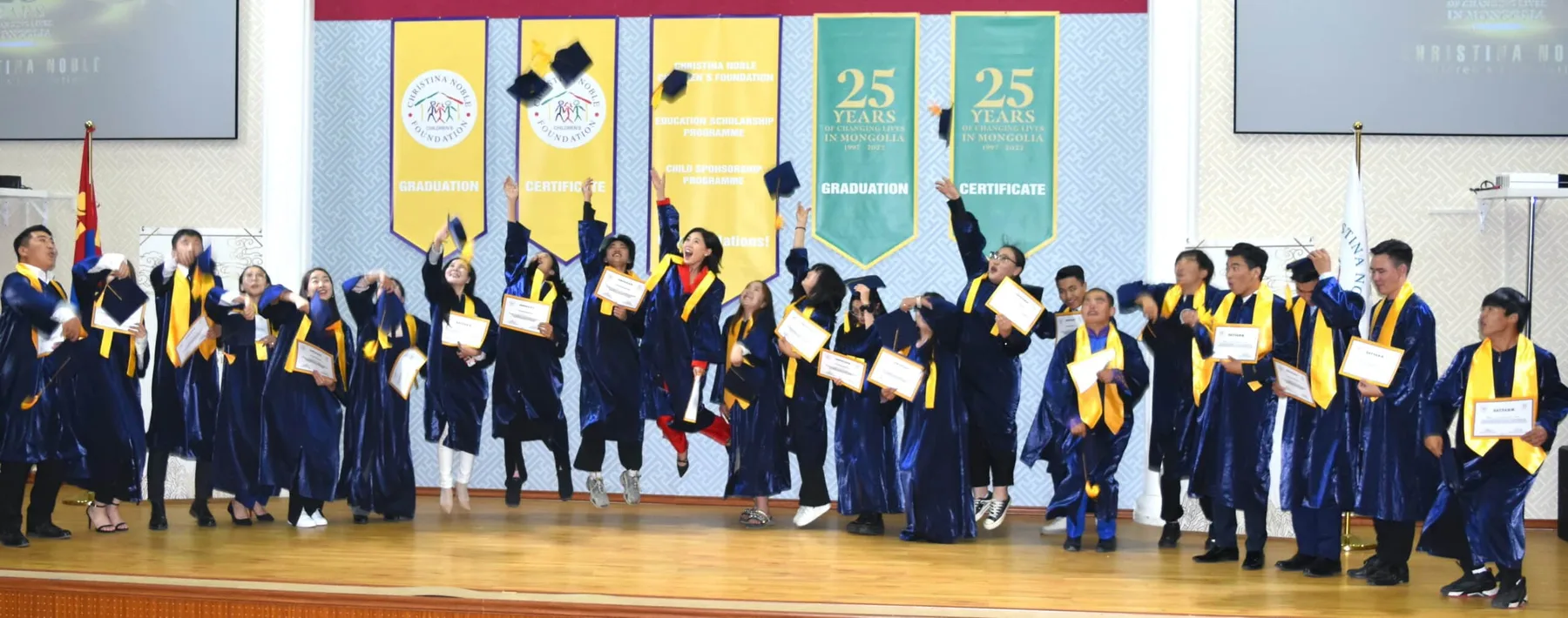 Graduates in Mongolia throw their caps in the air